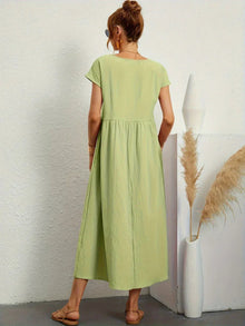 Adéla – Volné midi šaty s kapsami pro každodenní eleganci